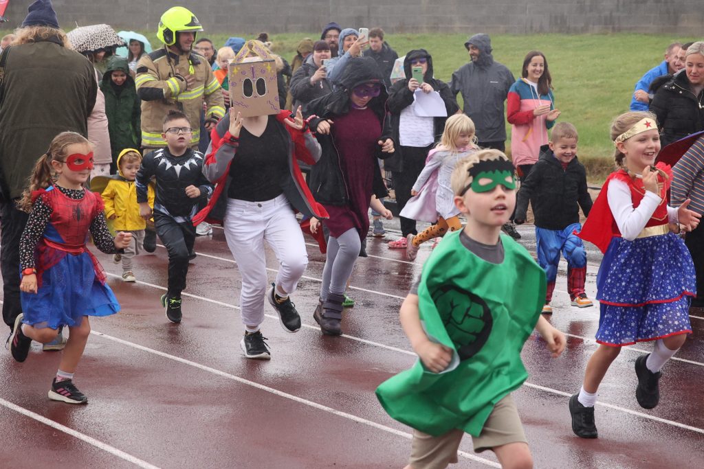 Children running on a race track