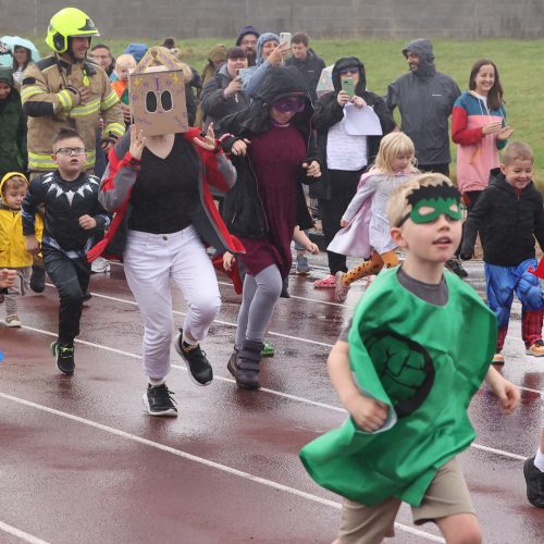 Children running on a race track